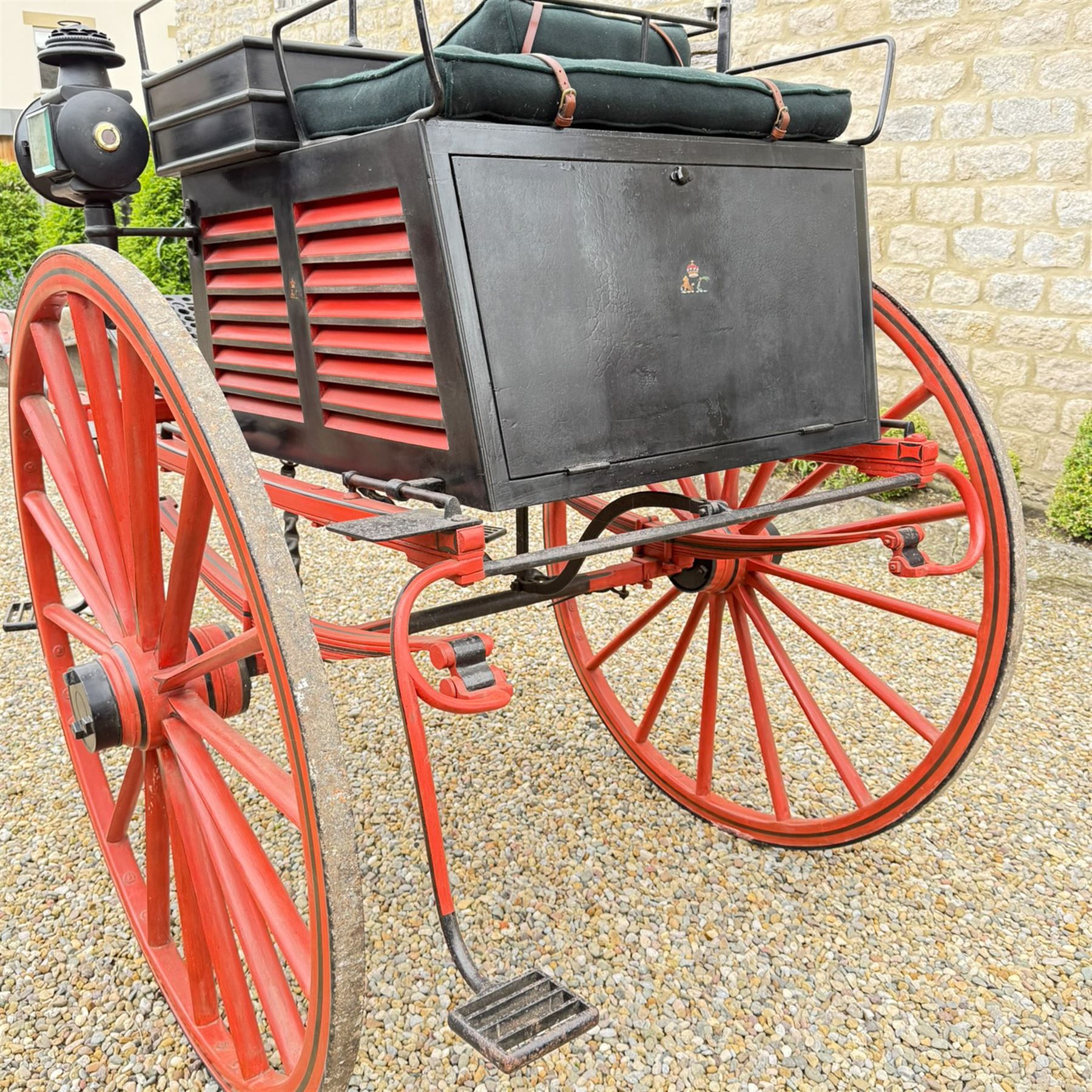 Holland & Holland Tandem Cart - Althorp Spencer Family Estate

A two wheeled tandem cart or cocking cart by Holland & Holland Coach Builders, London, with black painted bodywork, red painted shafts and running gear, red wooden spoked wheels with rubber tyres, green upholstered seating and a rear perforated metal footboard. The cart is fitted with carriage lamp brackets (lamps next lot), green buttoned cushions with leather retaining straps, side louvered body panels, footrests, leaf spring suspension and shafts for horse use. The carriage incorporates an adjustable body position, operated by a lever, allowing the body to be moved forwards or backwards to alter the weight distribution. Formerly owned by the family of Lady Diana Spencer,
Sympathetically conserved by Woods of Fairbourne Carriages Ltd, Kent.

Features:
• Brass maker’s plaque for Holland & Holland Coach Builders, London
• Two wheeled tandem cart
• Black painted body with red painted shafts and running gear
• Red wooden spoked wheels with rubber tyres
• Green upholstered cushions with leather retaining straps
• Adjustable carriage body for weight distribution
• Lever operated adjustment mechanism
• Perforated rear footboard
• Side footrests
• Louvered side panels
• Leaf spring suspension
• Rear opening storage compartment
• Decorative painted armorial motif to rear panel
• Fitted carriage lamps shown, not included in the lot (available as next lot)
• Conserved by Fairbourne Carriages Ltd
• Provenance: The Althorp Attic Sale including The Spencer Carriages, lot 195, 7 July 2010

Dimensions:
Overall length 396 / 198cm
Width 155cm
Height 190cm

Wheel Diameters:
Wheels: 148cm

Seating:
Driving seats: 2
Passenger seats: 2