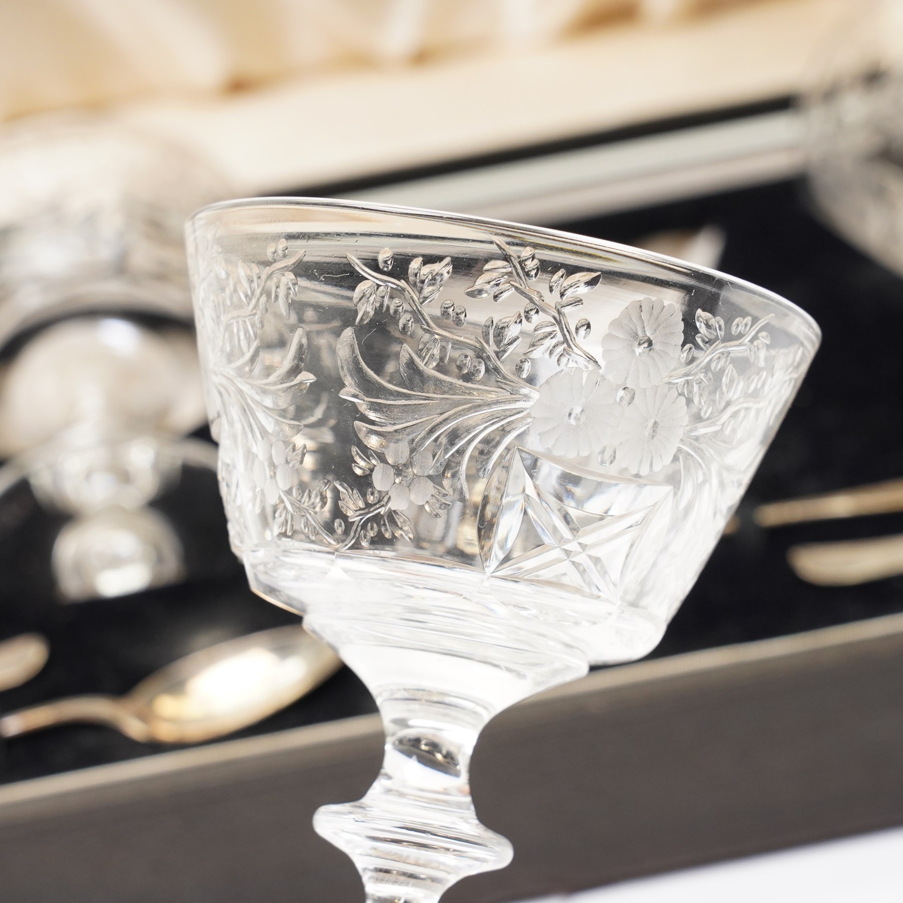 Set of six Tudor crystal compote glasses with silver spoons, in presentation case 