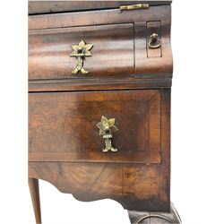 Small early 20th century Queen Anne style bookcase on bureau secretaire, the moulded arched pediment over mirrored door in shaped frame, the bureau fitted with fall front enclosing curved fitted interior, cushion moulded drawer over single drawer, on scroll and shell carved cabriole supports