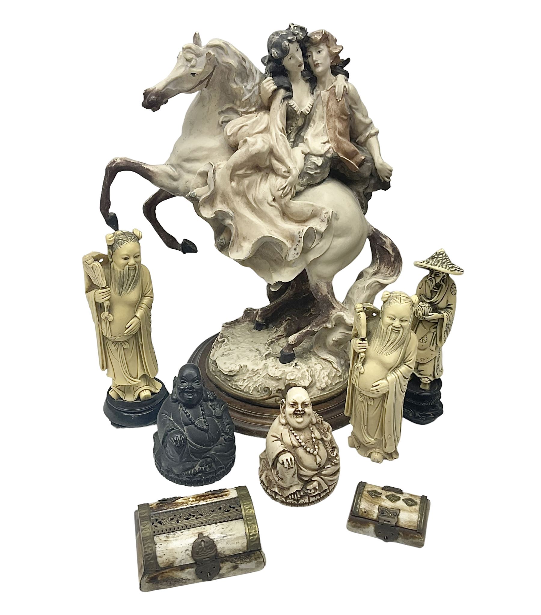 Composite figure of a couple upon a rearing horse, together with a collection of resin immortals and two bone chests 