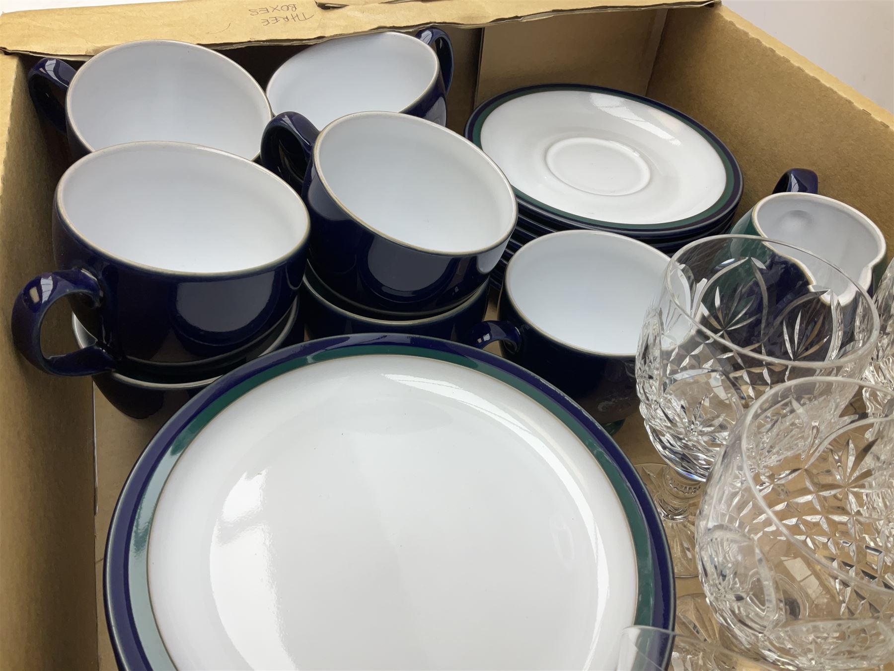 set of six Dartington champagne glasses, with an internal elongated tear in the stem, together with a set of six wine glasses and Denby regatta pattern tea wares comprising of milk jug, eight dessert plates, nine tea cups and eight saucers 