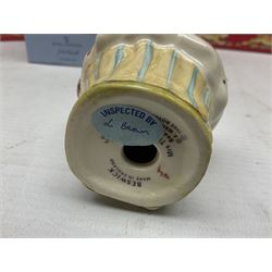 Royal Doulton The Mickey Mouse Collection Pluto figure, Coalport Characters The Snowman Dressing Up figure, three Royal Doulton Bunnykins figures comprising Policeman, Morris Danger and Eskimo, and display stand, Royal Doulton John Beswick Tiggy Winkle, Royal Albert Beatrix Potter Peter Postbag and three Goebel Hummel figures, all boxed