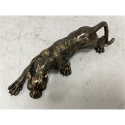 Cast metal figure modelled as a cougar in crouching pose, L40cm
