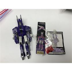 Four 1980sTransformer G1 - Optimus Prime 1984; DinoBot Sludge (Diplodocus) 1984; Cyclonus 1986; and Runamuck 1986; with paperwork; seven Bandai Robo Machines Robots/Transformers; almost fully stocked Panini Sticker album; two annuals; three comics; two posters; and Ladybird story book