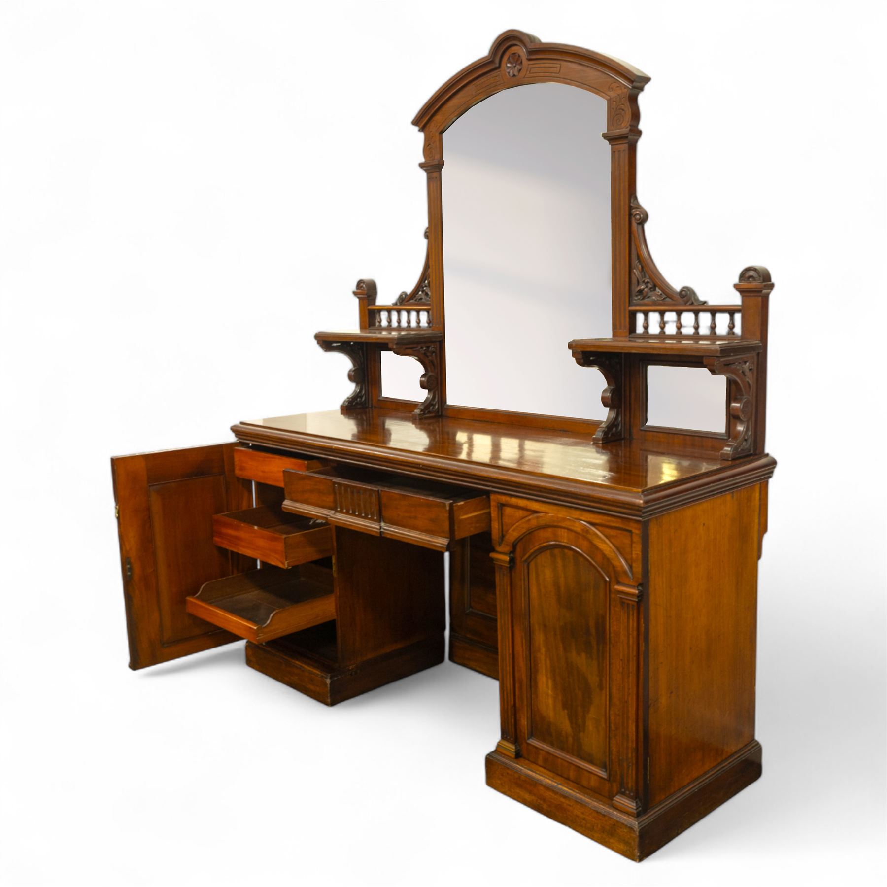 Late 19th century mahogany twin pedestal mirror back chiffonier, stamped James Winter of London, the arched mirrored back flanked by turned gallery shelves above a rectangular top, the base fitted with a pair of arched panelled cupboard doors, on a plinth base