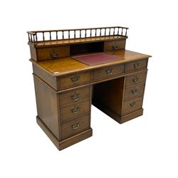 20th century oak twin pedestal clerks' desk, fitted with eleven drawers, raised gallery, tilting leather inset