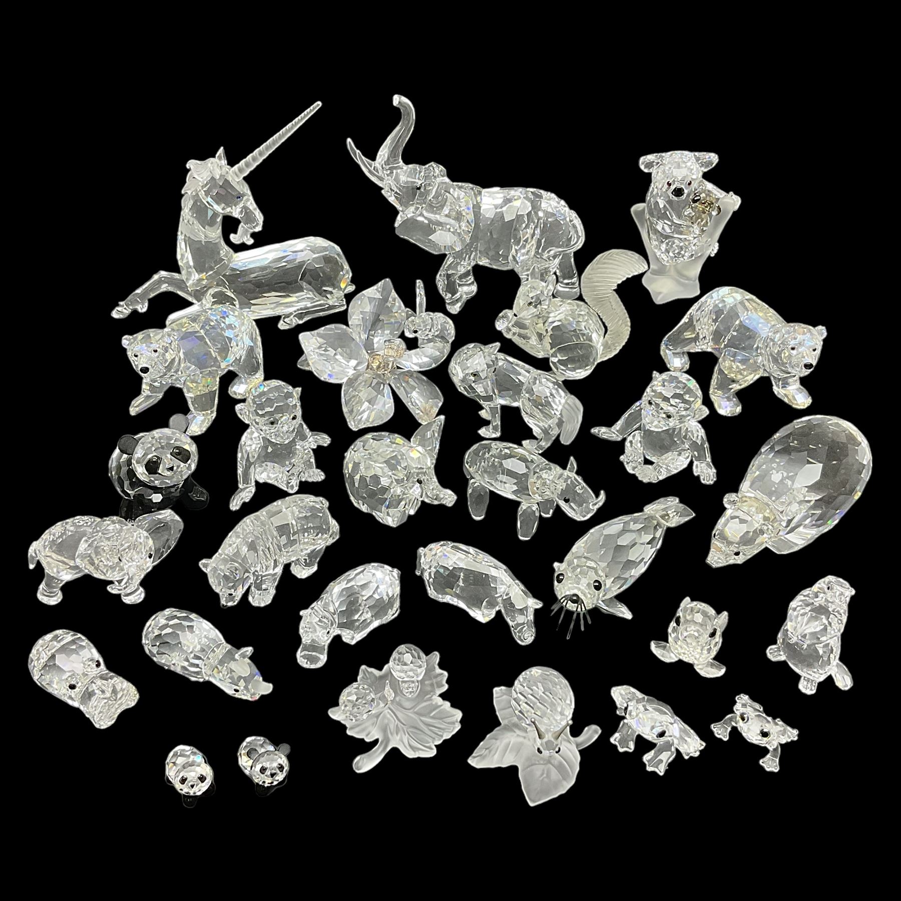 Twenty nine Swarovski Crystal animals, to include koala and baby, in frosted tree branch, elephants, polar bears, squirrel, monkeys, panda, unicorn and snails, etc 