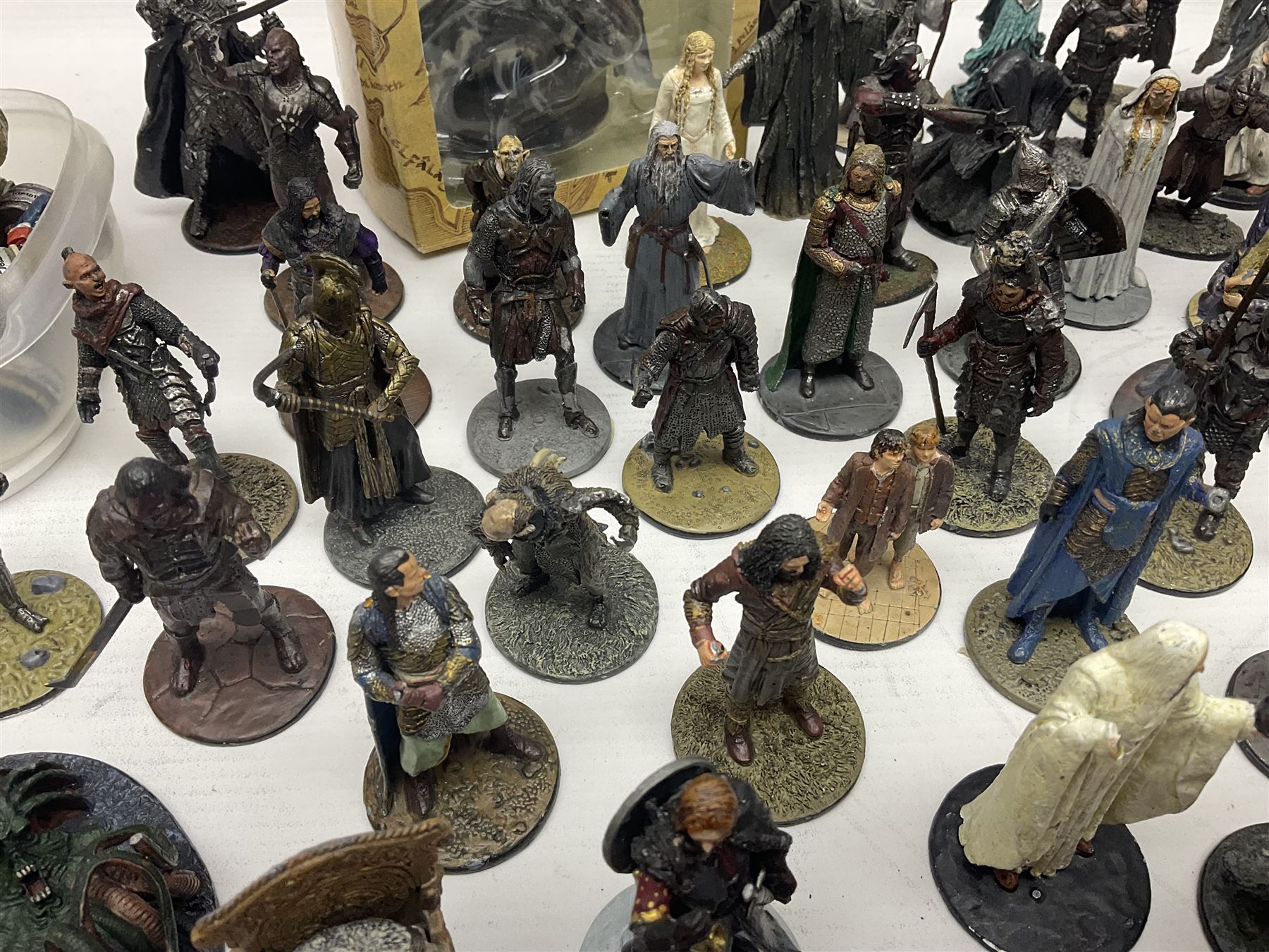 Approximately 80 NLP Lord of the Rings heavy metal painted figurines to include Fell Beast, boxed, and The Watcher, The Dark Lord Sauron, Treebeard etc, and unassociated Dracula themed composite figures marked HHFT50 