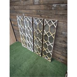 Four 19th century cast iron windows, lattice glazed in white painted finish, 