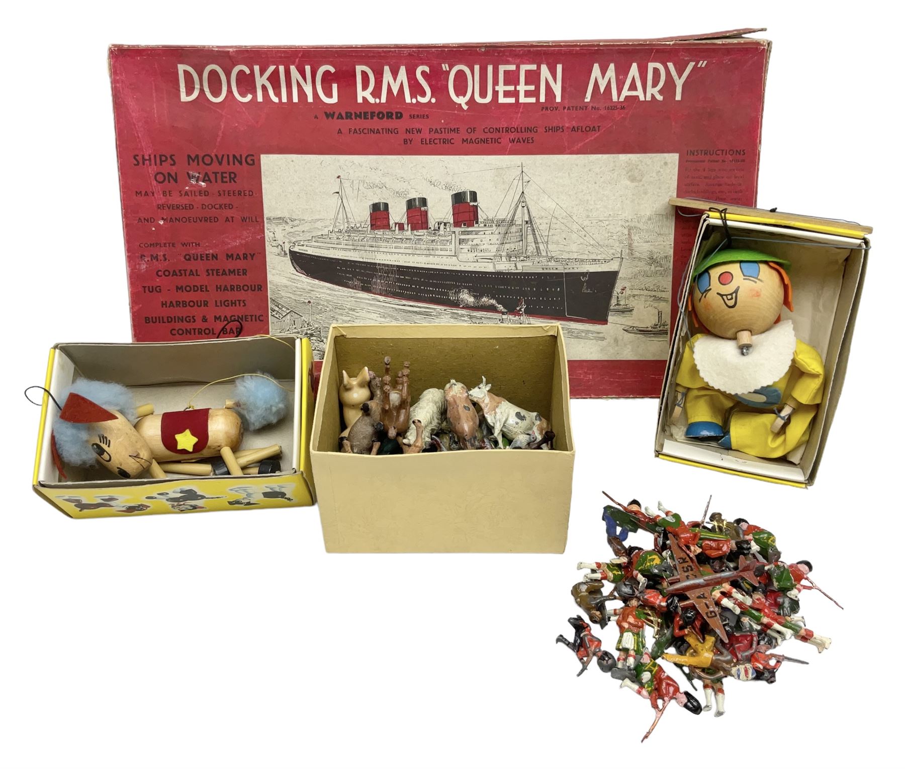 Vintage toys comprising 'Docking RMS Queen Mary' game, two boxed Pelham puppets, quantity of painted metal British soldiers to include Guardsmen, painted farm animal figures