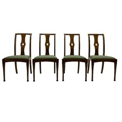 Set of eight contemporary walnut dining chairs, curved backs set with shaped splats with pierced detail, drop in upholstered seat cushions, on turned supports 