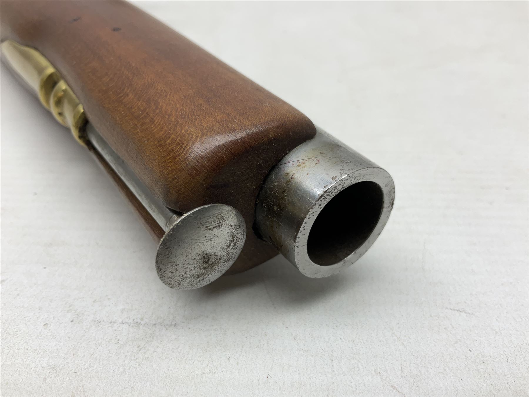 Reproduction non-firing flintlock pistol with brass skull crusher butt, the lock-plate inscribed 'Tower' and 'GR' L40cm; Sabre Japan Original Bowie Knife in sheath; and Indian embossed nickel two-piece walking cane (3)