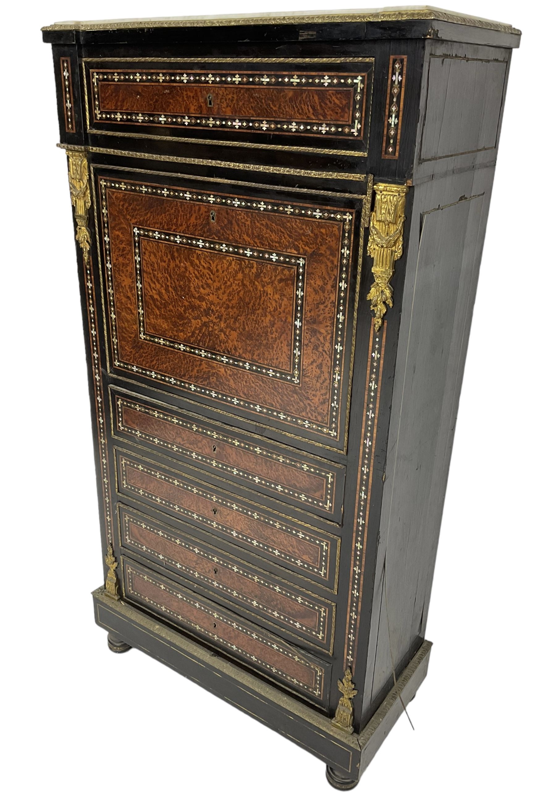 Late 19th century French ebonised and amboyna secrétaire à abattant, white marble top over frieze drawer, fall front and four further drawers, inlaid with trailing pattern in mother of pearl, mounted by cast gilt metal brackets with floral festoons, plinth base with foliate mounted edging and brass stringing, on turned feet 