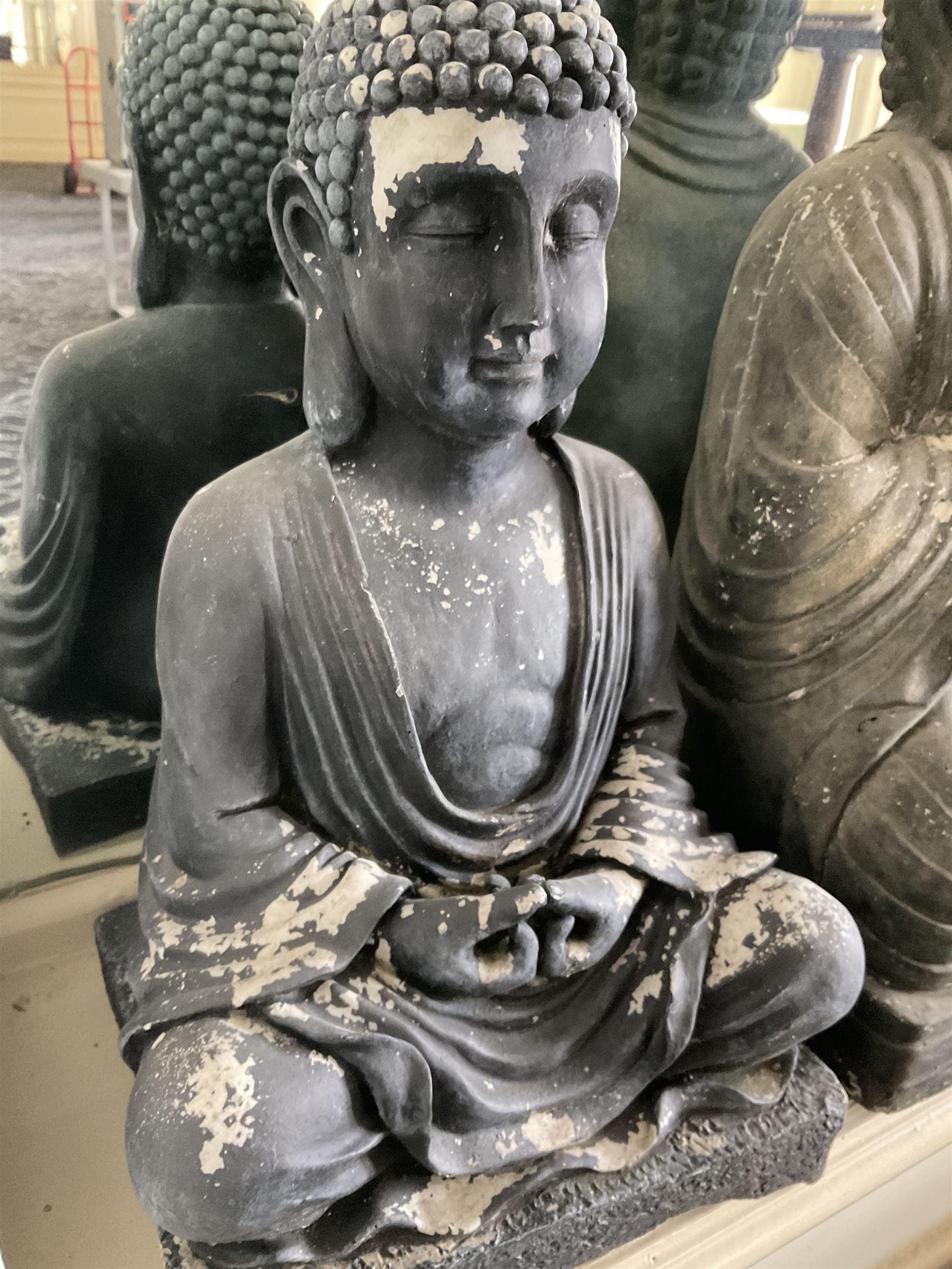 Three cast seated Buddhas and an elephant (4)- LOT SUBJECT TO VAT ON THE HAMMER PRICE - To be collected by appointment from The Ambassador Hotel, 36-38 Esplanade, Scarborough YO11 2AY. ALL GOODS MUST BE REMOVED BY WEDNESDAY 15TH JUNE.
