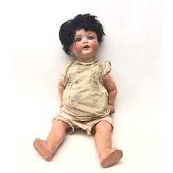  A German Armand Marseille bisque headed doll, with sleeping eyes and composition limbs, marked Koppelsdorf Germany 1330 A7M, approx 49cm high.   