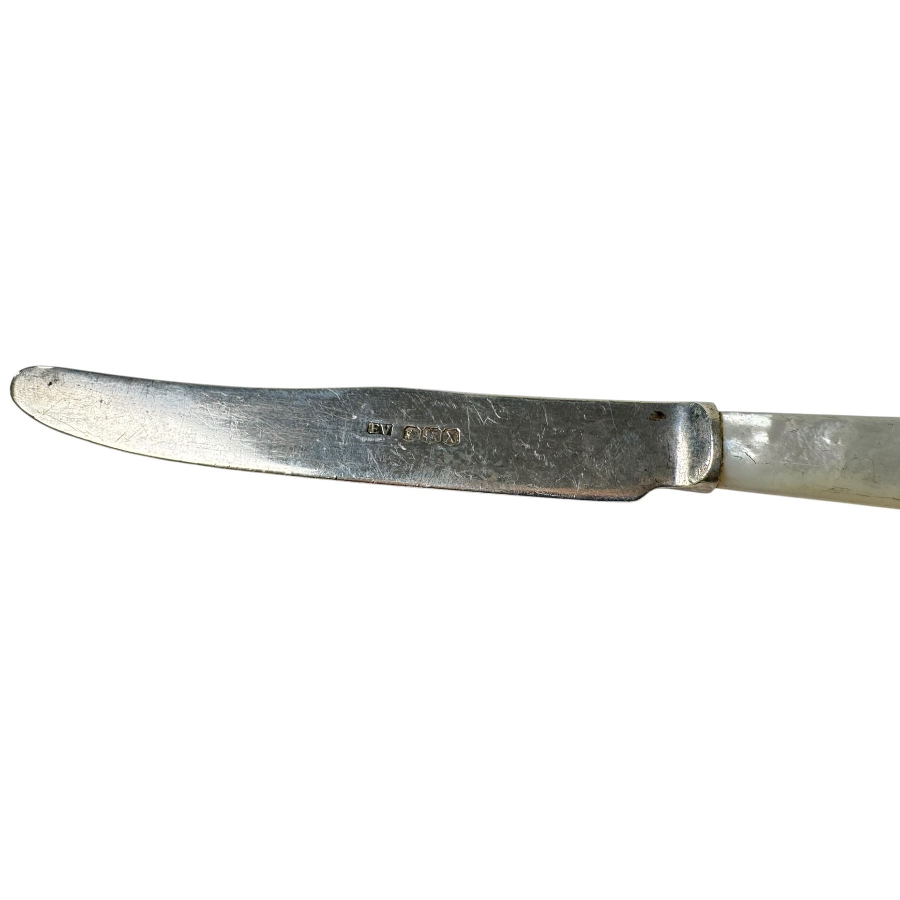 Collection of silver cutlery, including teaspoons, tablespoons, mother of pearl handled butter knife, fork and sugar tongs, all stamped or hallmarked