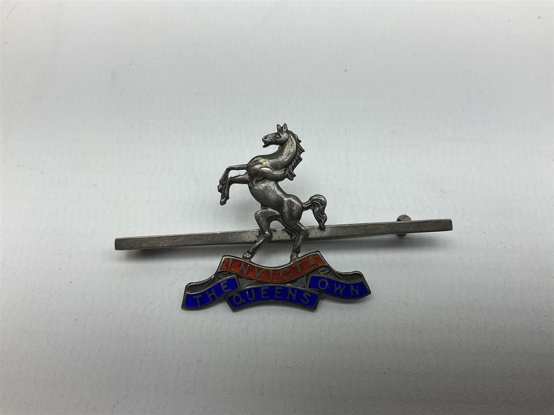 Royal West Kent regiment 9ct gold and enamel sweetheart brooch; The Queens Own regiment silver and enamel sweetheart brooch; and another sweetheart brooch for the Royal West Kent regiment (3)