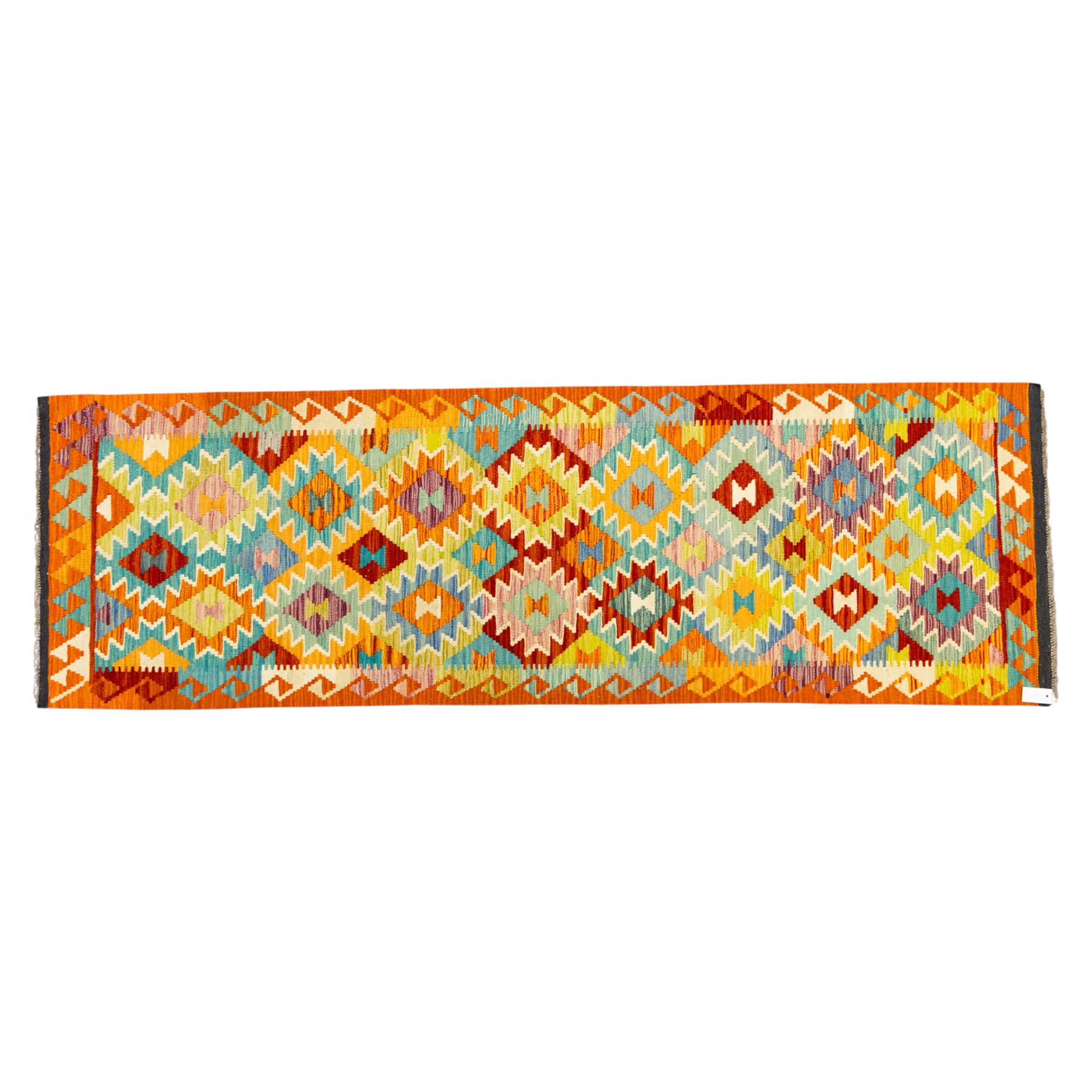 Afghan Chobi kilim flatweave runner with a repeating stepped diamond medallion design in live green, rust, teal, purple, and ivory, framed by chevron and geometric borders