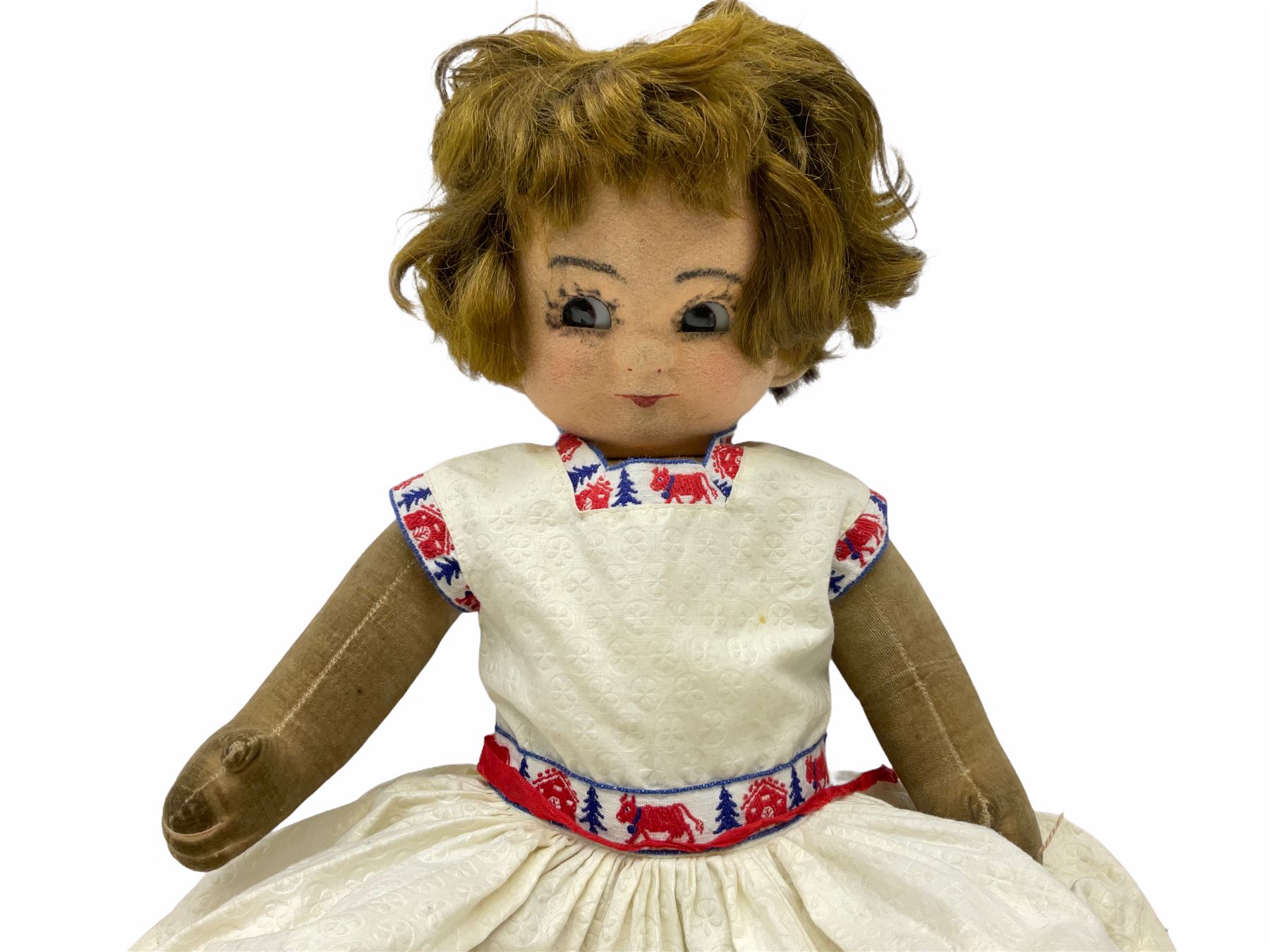 1920s Chad Valley 'Bambina' doll, the pressed felt head with applied hair, side glancing inset glass eyes, painted facial features and velvet jointed body, Hygenic and Bambina labels to the feet H46cm