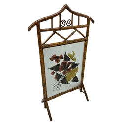 Victorian bamboo fire screen, pointed arched cresting rails over floral painted glass panel 