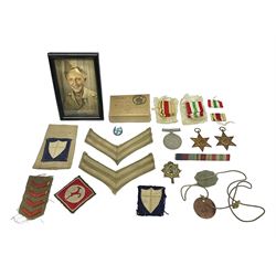 WWII group of three medals comprising 1939-45 War Medal and Italy and Africa Stars in issue box; dog tags for 282894 W. Wilkinson with framed photograph in uniform; and small quantity of cloth and metal badges including RAOC cap badge