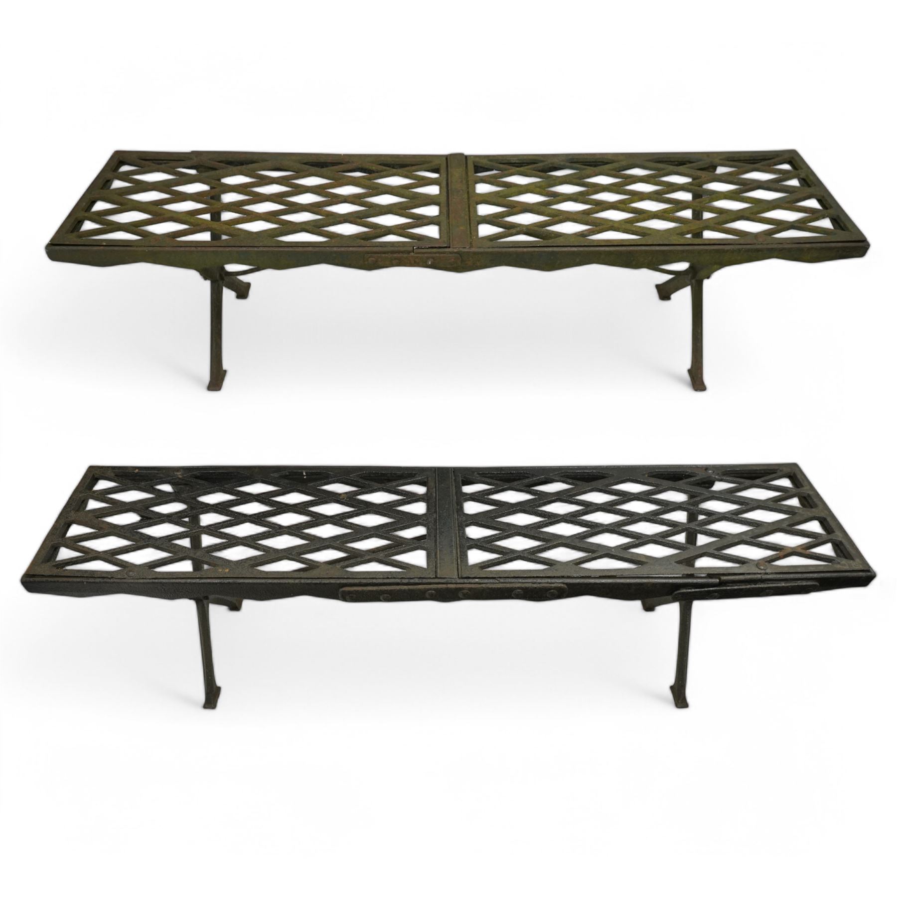 Two cast iron garden benches, rectangular seat with lozenge grate panels, on X-framed supports 