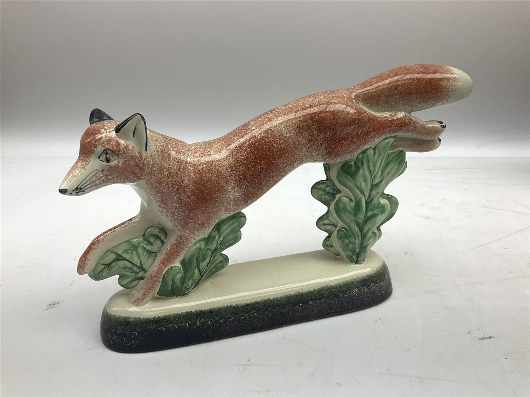 Six Rye Pottery figures, comprising, jumping fox, squirrel upon a branch, billy goat, bull, chicken and cockerel  