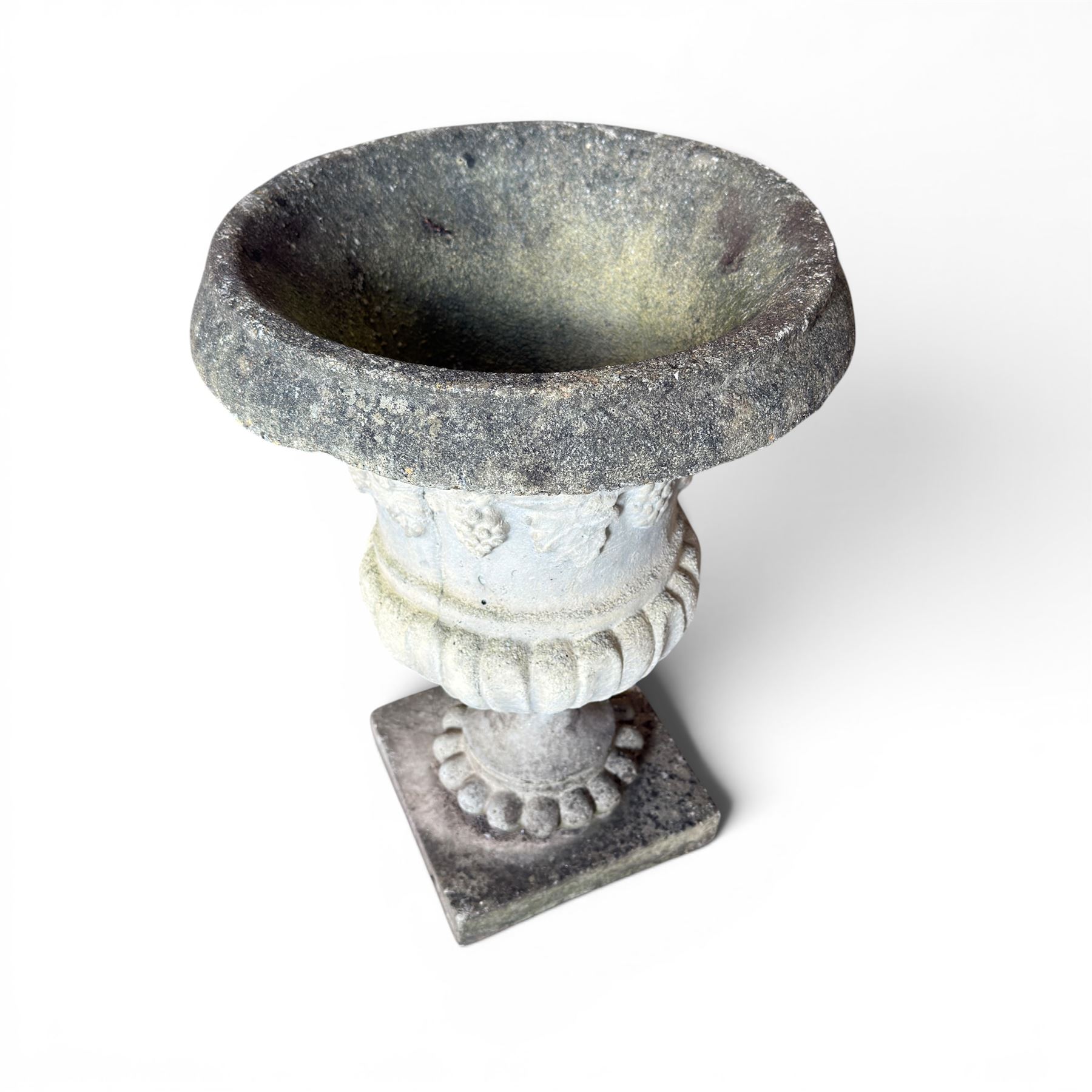 Cast stone classic garden urn, raised on squat pedestal and an ornate cast stone urn (2)