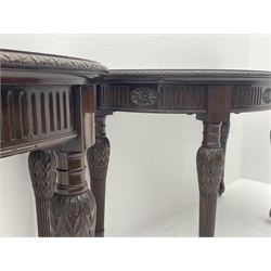 Pair early 20th century Hepplewhite style mahogany D-end console tables, the curved top with foliate carved edge, fluted frieze rails carved with flower heads, turned and reeded acanthus supports with recessed castors