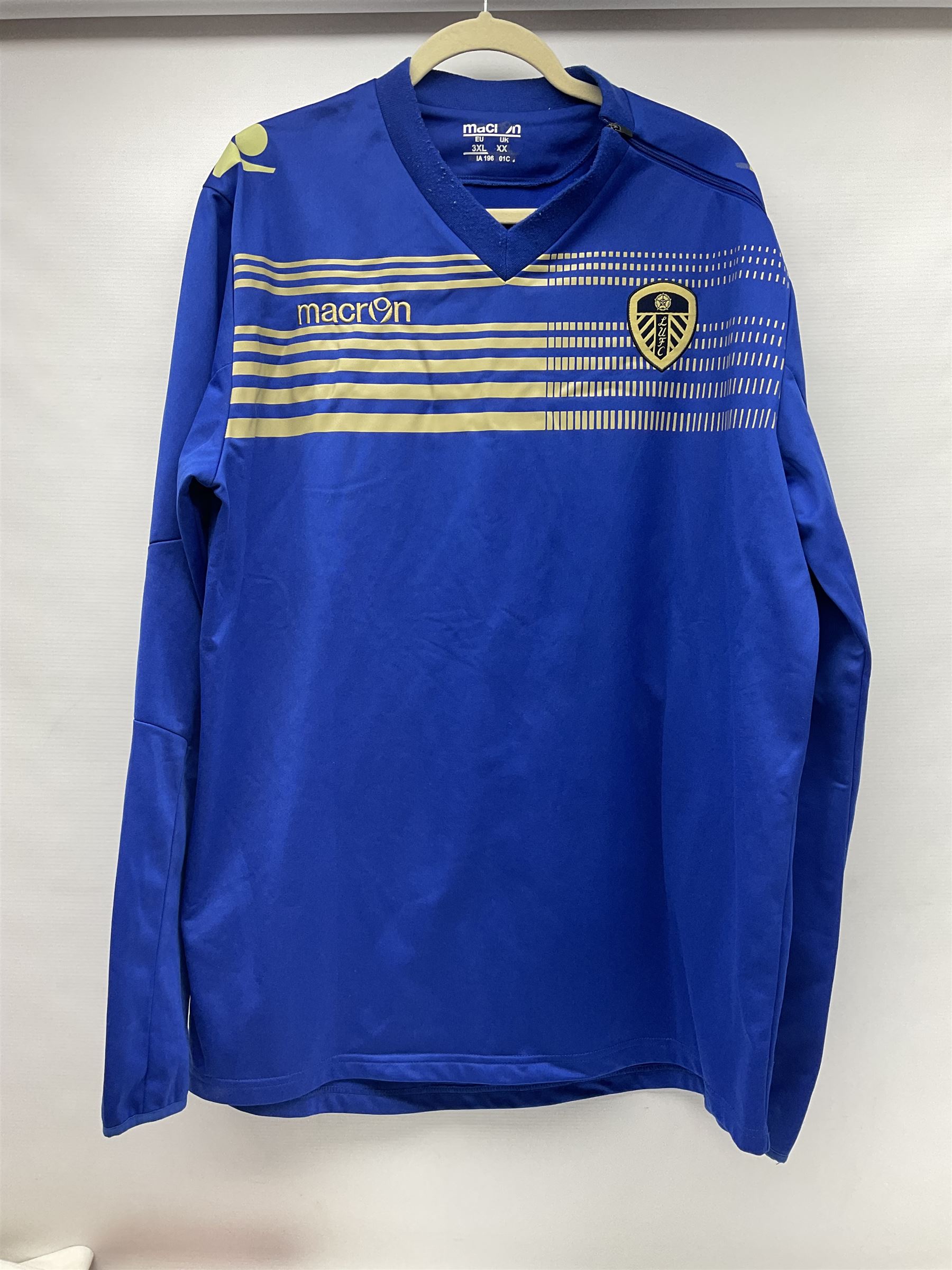 Fourteen items of replica sporting clothing including Leeds United football club shirts, England jerseys etc