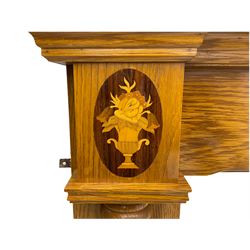 Light oak fire surround, set with three inlaid roundels
