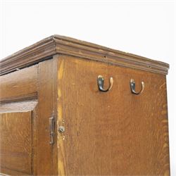 18th century oak press cupboard on chest, the moulded cornice above a pair of fielded panel doors enclosing shelved interior, the base fitted with four long graduated drawers with brass swan neck handles and shaped escutcheons, raised on bracket feet