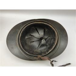 WW2 French M-26 Adrian Pattern Steel Helmet, original olive drab paint finish; flaming grenade badge to the front signifying issue to an Infantry regiment; original leather liner and leather chinstrap; and WW2 Dutch steel helmet with liner and chin strap (2)