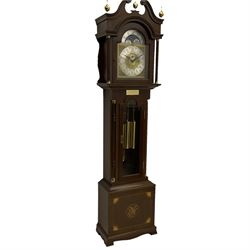 A  20th century longcase clock made to celebrate the millennium in the year 2000, this clock being No 2 of only 200 manufactured by  Richard Broad in Bodmin Cornwall, with a mahogany effect case and traditional swans neck pediment with three brass finials, break arch hood door on a trunk with recessed columns and full length glazed door, on a square plinth with inlay and a shaped base, brass dial with brass spandrels, silvered chapter ring, seconds dial and working moon phase to the arch, weight driven three train movement striking the quarters and hours on 12 gong rods, with a choice of St Michael, Westminster and Wittington chimes, with chime selector and chime/silent facility. With three brass cased weights and gridiron pendulum.





