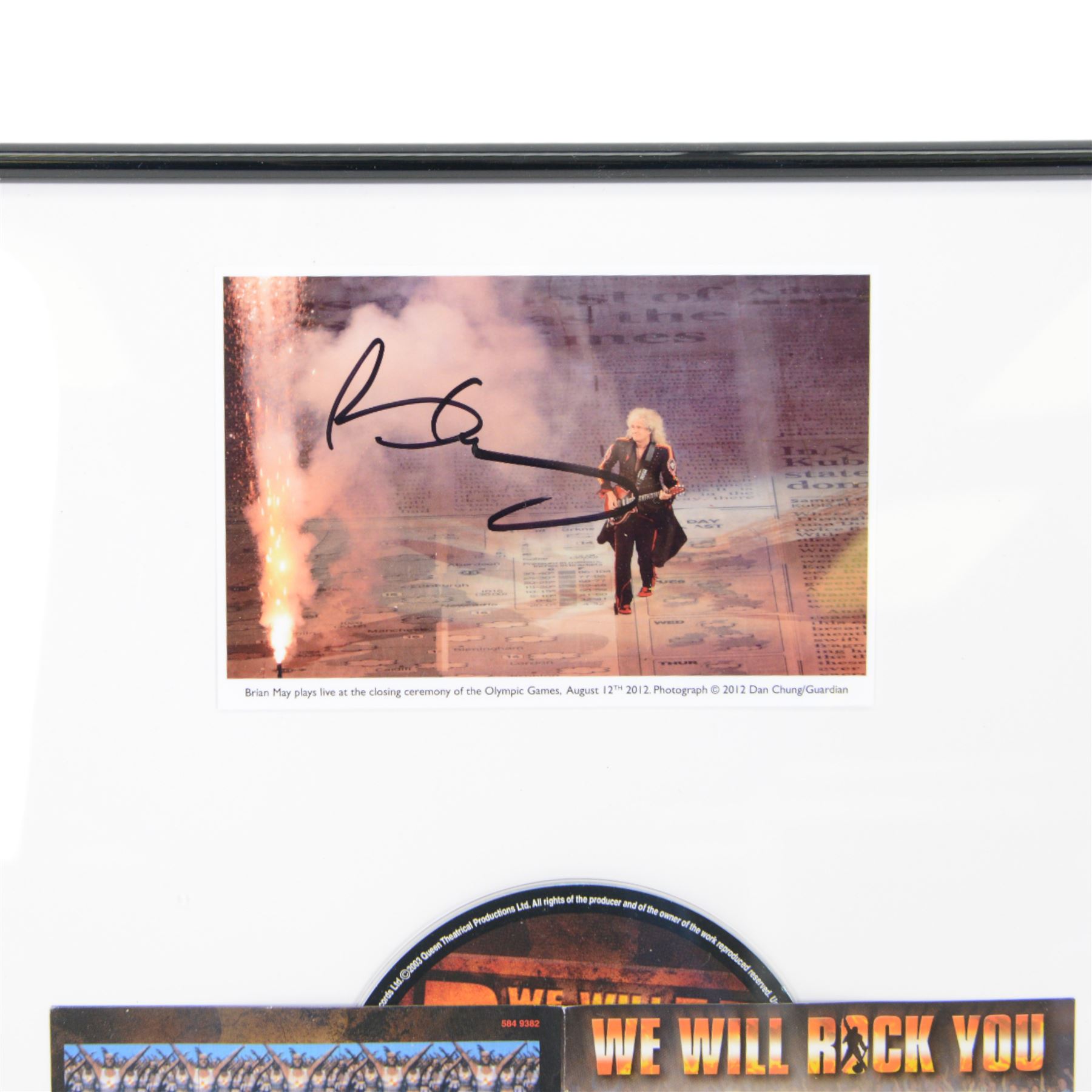 Signed photograph of Brian May playing at the 2012 Olympic Closing Ceremony, framed with Queen We Will Rock You The Musical sleeve