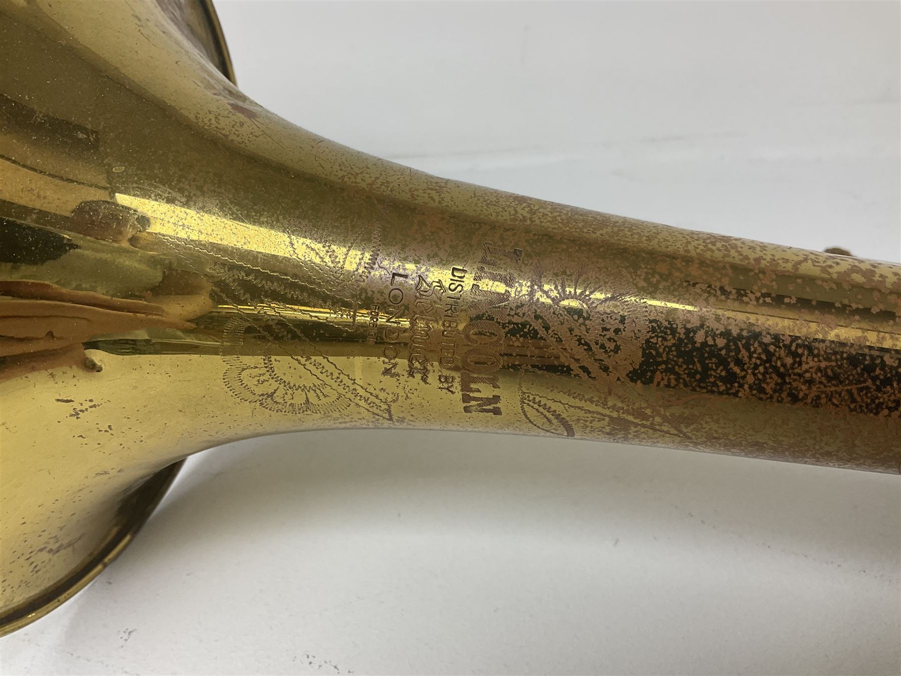 Three brass trombones comprising Elkhart Ind. USA 'CONN' model no.72H; Besson 'Concord'; and Selmer Distributed 'Lincoln'; two in carrying cases; and German B & M 'Champion' brass trumpet (4)