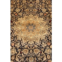 Persian Nain carpet, floral design on dark blue field, central rosette medallion, ivory ground outer border, 430cm x 305cm