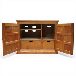  Beaverman - oak media cabinet, rectangular top with interictally carved panels to the side and front doors, twin doors with Yorkshire Rose carved wooden knob, enclosing a staggered shelf arrangement above two drawers, raised on a moulded plinth base, with carved beaver signature, by Colin Almack of Sutton near Thirsk