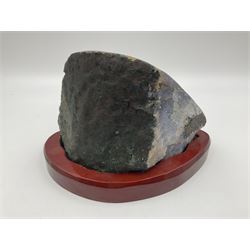 Amethyst crystal geode cluster, with well-defined crystals of various sizes, upon a carved wooden stand, H12cm, L20cm