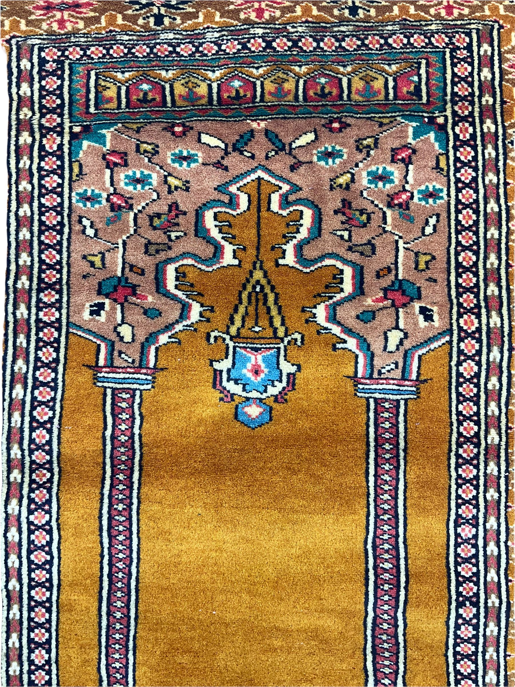 Angle-poise lamp and an Islamic prayer mat