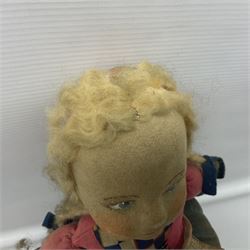 Farnell Alpha Toy soft toy of a Dutch girl, the pressed felt head with applied hair and painted features and overstuffed full length dress with apron and clogs; inoperative clockwork musical movement H31cm