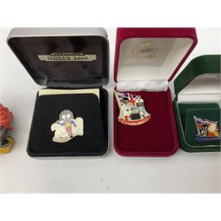 Eight ceramic Golly Band figurines marked Carlton Ware, together with four other Golly figures and five boxed badges