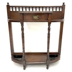 Edwardian oak hall stand, gallery back above single drawer, turned supports joined by solid undertier with umbrella trays