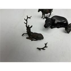 Japanese bronze okimono modelled as a recumbent cow, together with three further small bronze figures of animals comprising donkey, dog and deer, largest L12cm