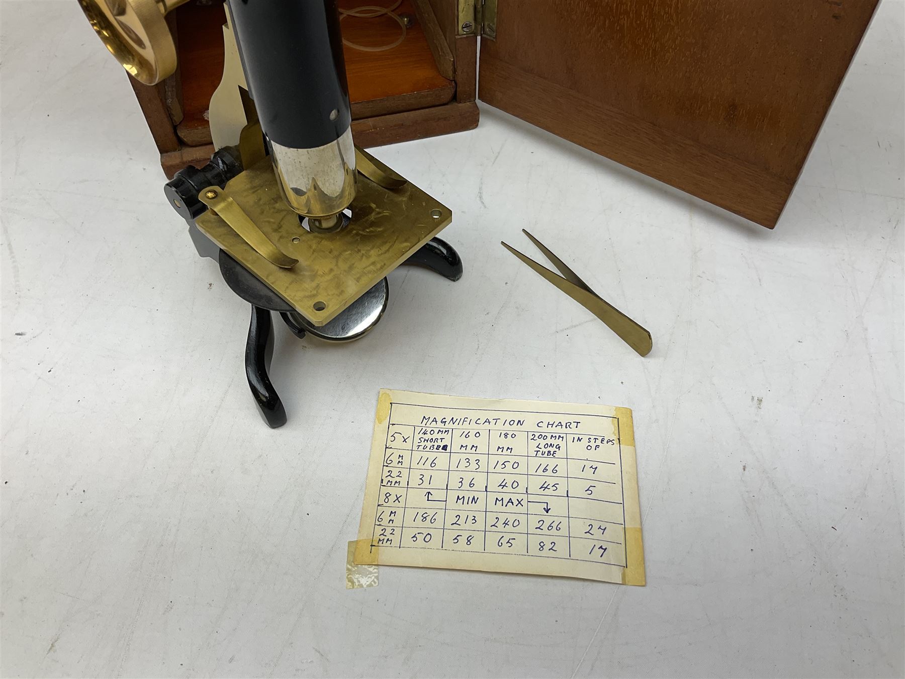  Brass field microscope, together with a cased microscope and twenty five microscope slides