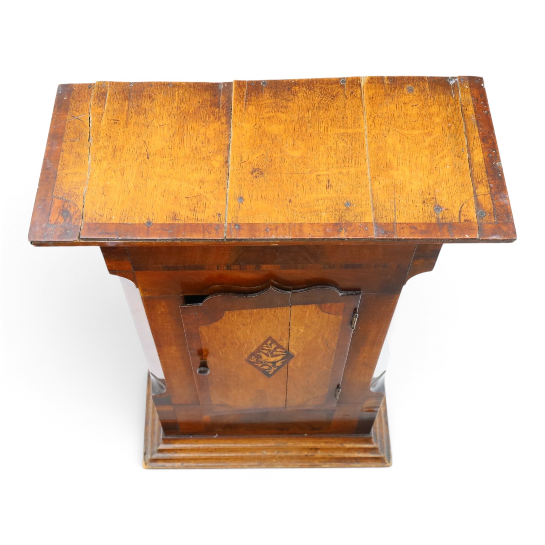 19th century clock trunk cupboard, veneered front with cantered corners, stepped plinth base