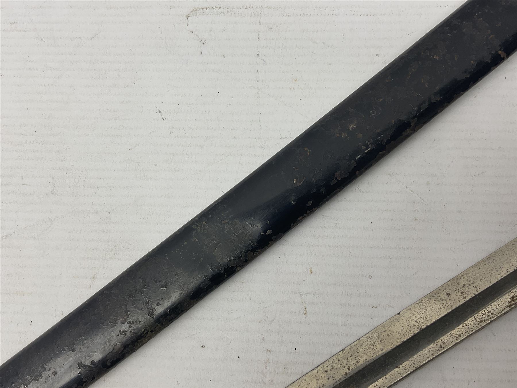 Prussian artillery officer's sword, with 80cm slightly curving fullered  blade, brass hilt with D-shaped langets, curving knucklebow, wire-bound black grip and leather finger loop; in black painted steel scabbard with single suspension loop
