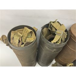 Four WW2 French gas masks in tins with some accessories