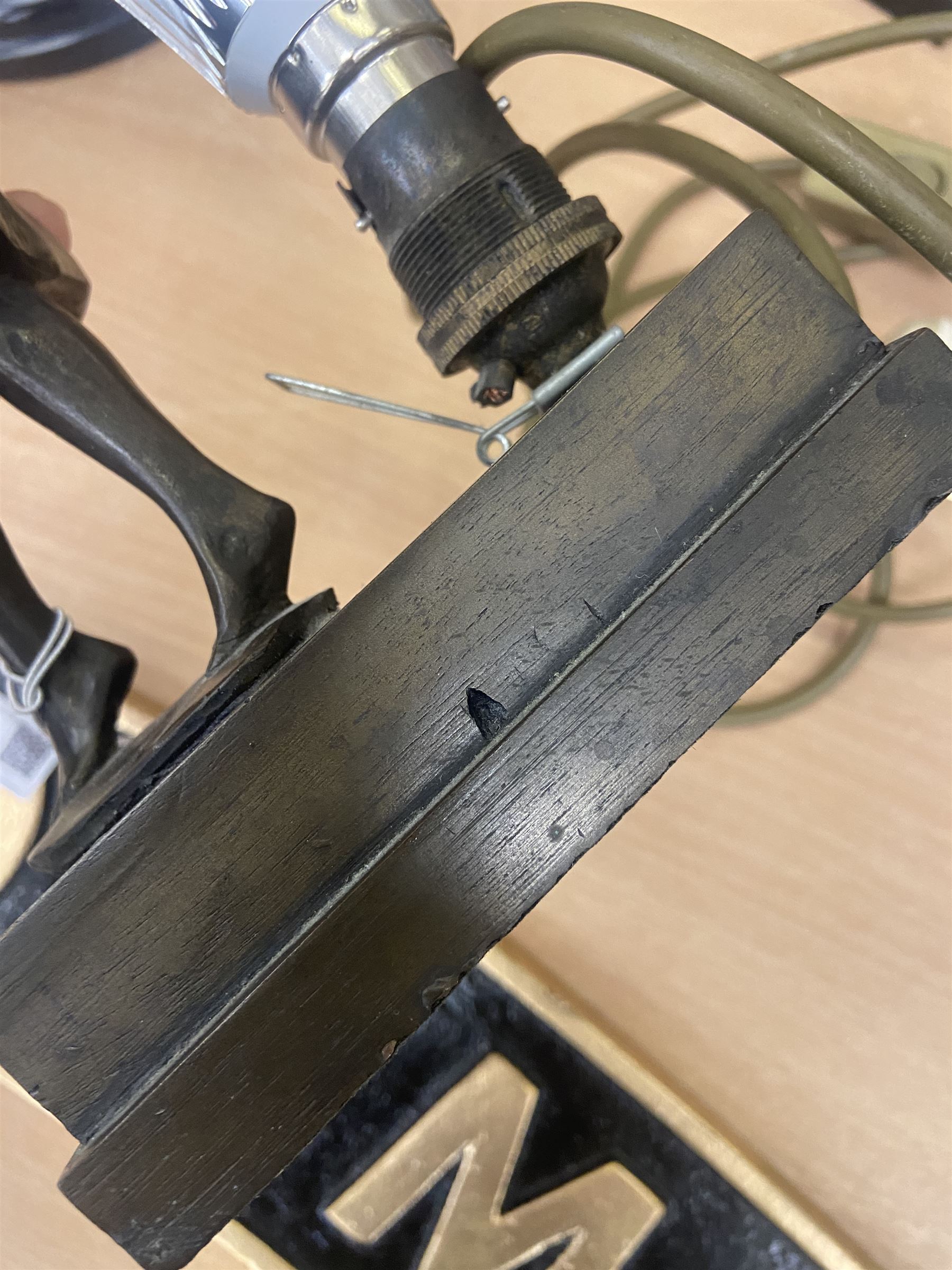 Art Deco style table lamp, modelled in the form of a bronzed female figure before a leaded glass fan shaped shade, H38cm