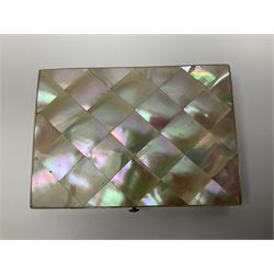 Victorian mother of pearl tea caddy, of rectangular bow-fronted form, the body with floral, bird and geometric engraved mother of pearl panels, white metal shield plaque to the cover inscribed with the initials G.J.A and similar escutcheon, the two division interior with ivory edging and two panelled mother of pearl lids, on four vegetable ivory bun feet L20cm, together with a similar style mother of pearl card case (2) This item has been registered for sale under Section 10 of the APHA Ivory Act